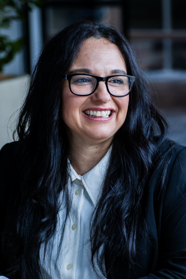 Team member smiling in a professional setting